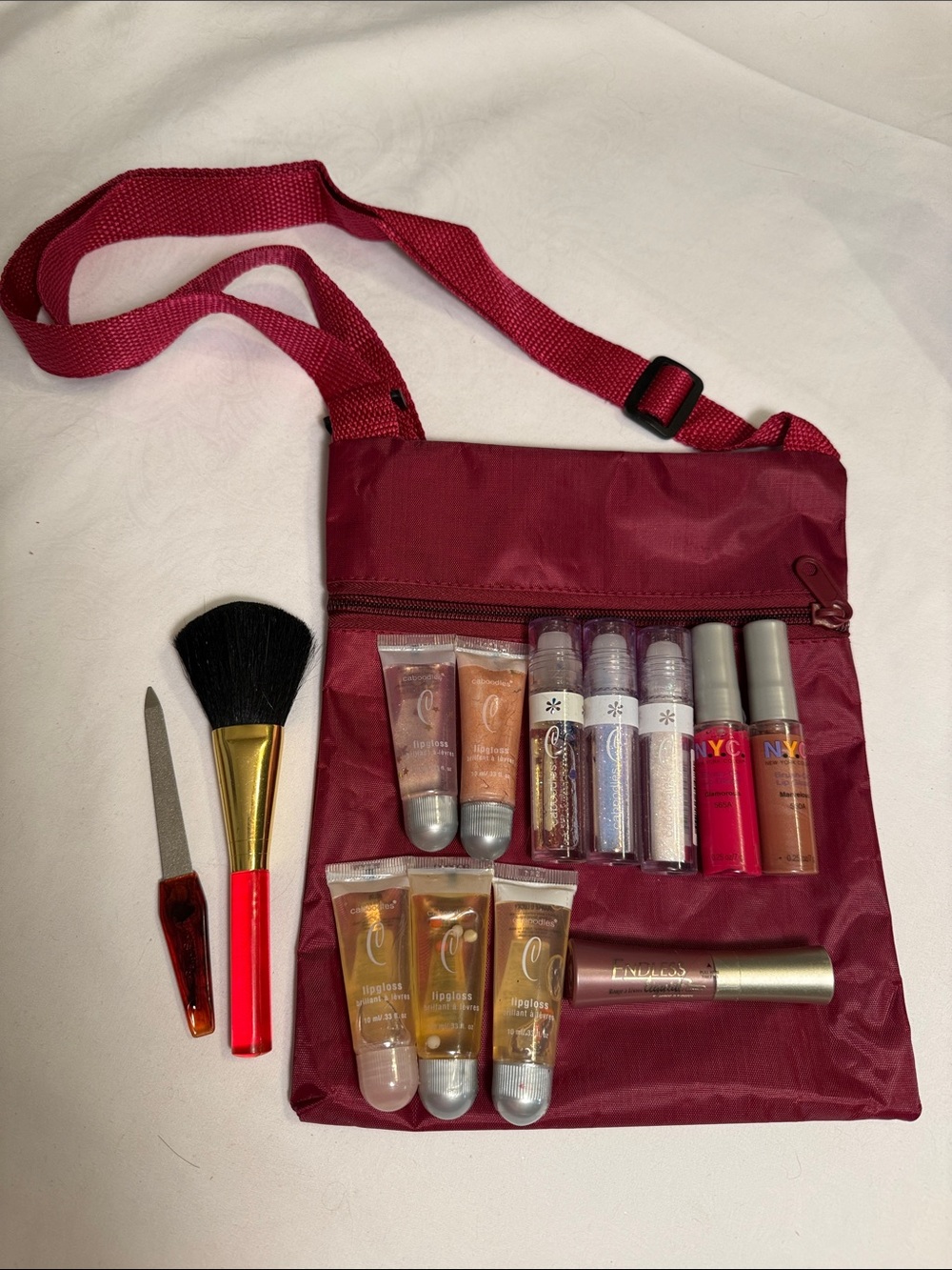 13 pc Set NYC & Assorted Lip Gloss Set in a variety of shades w a crossbody bag